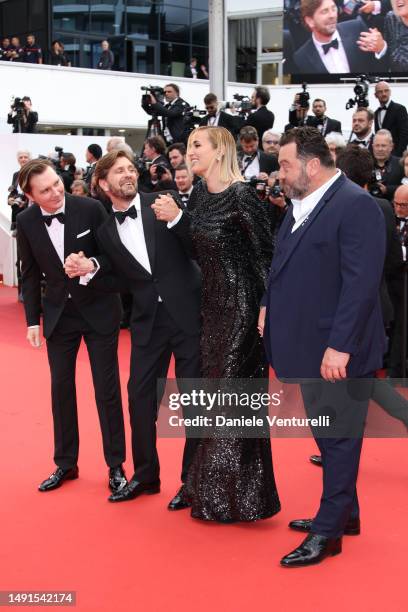 Members of the Jury Paul Dano, President of the Jury Ruben Östlund, Julia Ducournau and Denis Ménochet attend the "The Zone Of Interest" red carpet...