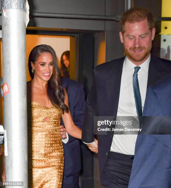 Meghan Markle, Duchess of Sussex, and Prince Harry, Duke of Sussex leave The Ziegfeld Theatre on May 16, 2023 in New York City.