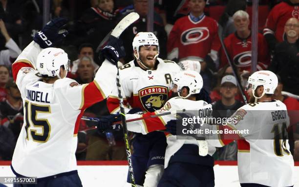 Matthew Tkachuk of the Florida Panthers celebrates with his teammates after scoring the game winning goal on Frederik Andersen of the Carolina...