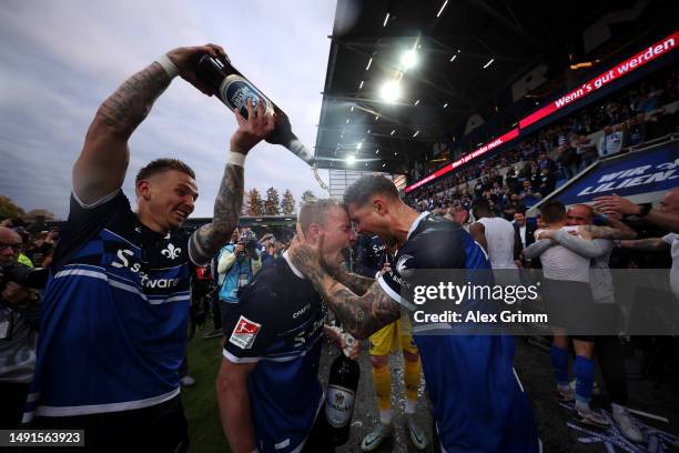 Tobias Kempe, Fabian Holland and Phillip Tietz of Darmstadt celebrate after the Second Bundesliga match between SV Darmstadt 98 and 1. FC Magdeburg...