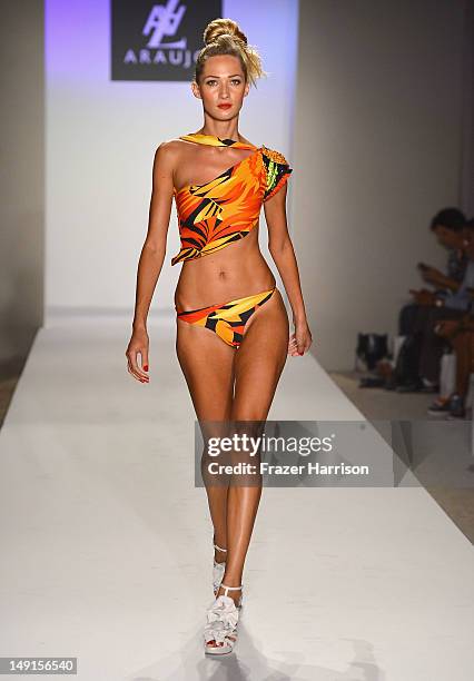 Model walks the runway at the A.Z Araujo show during Mercedes-Benz Fashion Week Swim 2013 show at The Raleigh on July 23, 2012 in Miami Beach,...