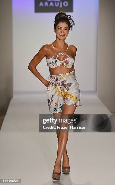 Model walks the runway at the A.Z Araujo show during Mercedes-Benz Fashion Week Swim 2013 show at The Raleigh on July 23, 2012 in Miami Beach,...