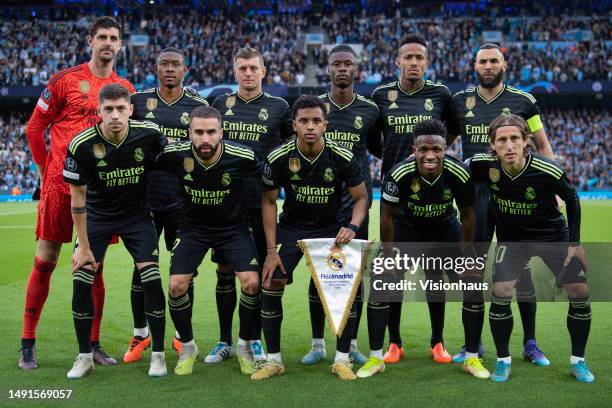 The Real Madrid team, back row l-r, Thibaut Courtois, David Alaba, Toni Kroos, Eduardo Camavinga, Éder Militão, Karim Benzema, front row l-r,...