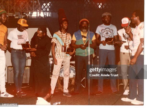 Rhythm guitarist and lead singer David Hinds with English roots reggae band Steel Pulse, Fr. Amde Hamilton priest of the St. Teckle Haymonot...
