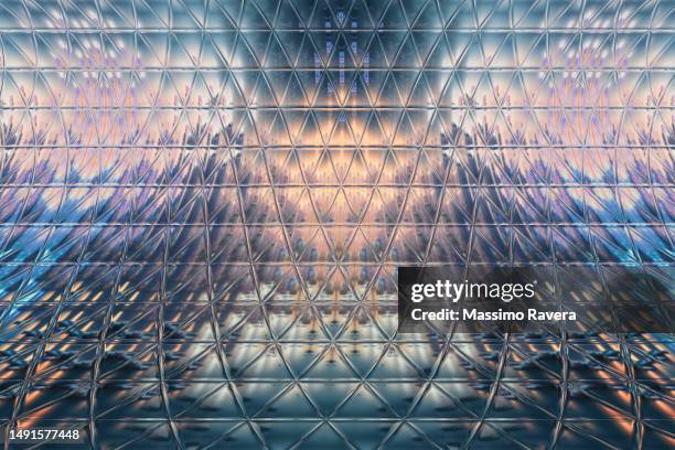 metallic surface reflecting cityscape at sunrise. - building triangle stock pictures, royalty-free photos & images