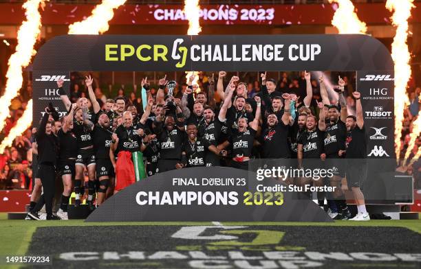 Mathieu Bastareaud of RC Toulon lifts the trophy and celebrates with his team mates following victory during the EPCR Challenge Cup Final between...