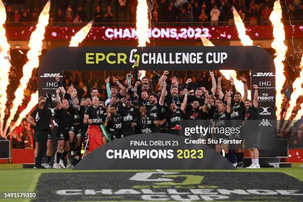 Mathieu Bastareaud of RC Toulon lifts the trophy and celebrates with his team mates following victory during the EPCR Challenge Cup Final between...