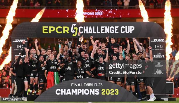 Mathieu Bastareaud of RC Toulon lifts the trophy and celebrates with his team mates following victory during the EPCR Challenge Cup Final between...