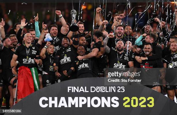 Mathieu Bastareaud of RC Toulon lifts the trophy and celebrates with his team mates following victory during the EPCR Challenge Cup Final between...