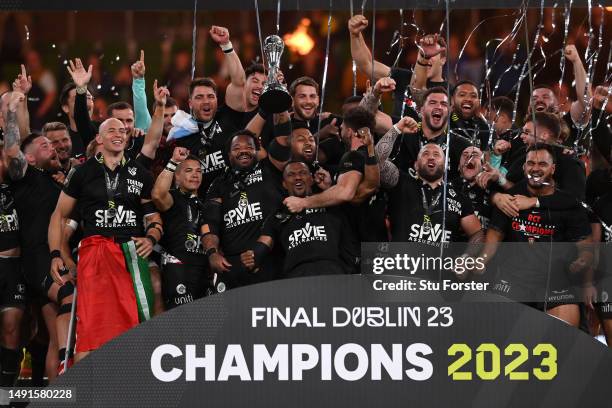 Mathieu Bastareaud of RC Toulon lifts the trophy and celebrates with his team mates following victory during the EPCR Challenge Cup Final between...