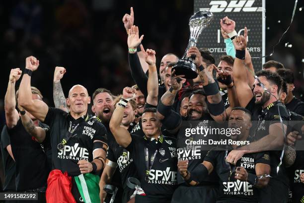 Mathieu Bastareaud of RC Toulon lifts the trophy and celebrates with his team mates following victory during the EPCR Challenge Cup Final between...