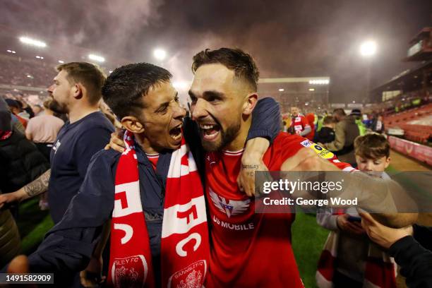 Adam Phillips of Barnsley celebrates victory with fans on the pitch following the Sky Bet League One Play-Off Semi-Final Second Leg match between...