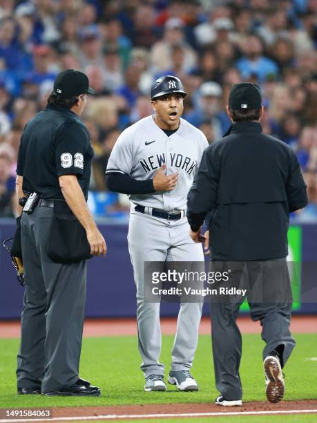 Third Base Coach Luis Rojas of the New York Yankees speaks to umpires during a game against the Toronto Blue Jays at Rogers Centre on May 16, 2023 in...