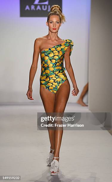 Model walks the runway at the A.Z Araujo show during Mercedes-Benz Fashion Week Swim 2013 Official Coverage at The Raleigh on July 23, 2012 in Miami...