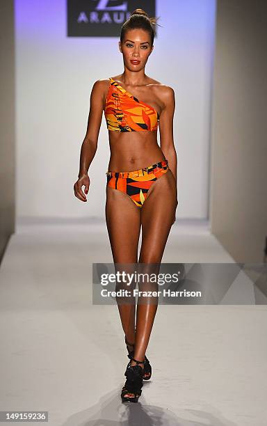 Model walks the runway at the A.Z Araujo show during Mercedes-Benz Fashion Week Swim 2013 Official Coverage at The Raleigh on July 23, 2012 in Miami...