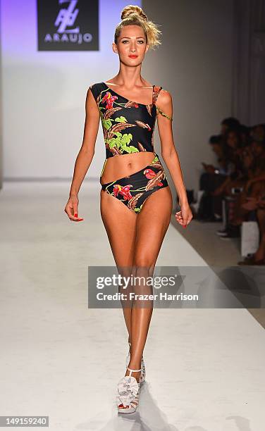 Model walks the runway at the A.Z Araujo show during Mercedes-Benz Fashion Week Swim 2013 Official Coverage at The Raleigh on July 23, 2012 in Miami...