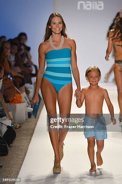 Model walks the runway at the Naila show during Mercedes-Benz Fashion Week Swim 2013 at The Raleigh on July 23, 2012 in Miami Beach, Florida.