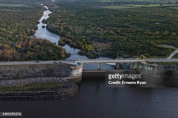 An aerial view shows the low level of water at Paso Severino Dam on May 17, 2023 in Florida, Uruguay. Paso Severino is considered the main fresh...