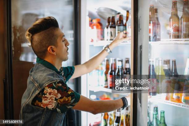 worker at the american convenience store in la - buying cigarettes stock pictures, royalty-free photos & images