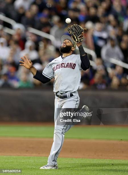 Amed Rosario of the Cleveland Guardians bobbles a hit by Mark Canha of the New York Mets in the sixth inning at Citi Field on May 19, 2023 in the...