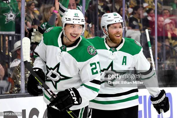 Jason Robertson of the Dallas Stars is congratulated by his teammates Joe Pavelski after scoring a goal against the Vegas Golden Knights during the...