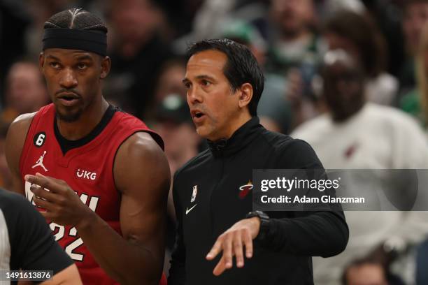 Miami Heat head coach Erik Spoelstra speaks with Jimmy Butler of the Miami Heat against the Boston Celtics during the first quarter in game two of...