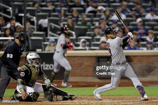 Gabriel Arias of the Cleveland Guardians hits a two run home run in the 10th inning as Francisco Alvarez of the New York Mets defends at Citi Field...