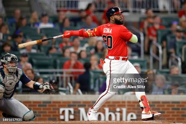 Marcell Ozuna of the Atlanta Braves hits an RBI single in the seventh inning against the Seattle Mariners at Truist Park on May 19, 2023 in Atlanta,...