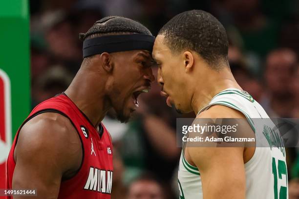 Jimmy Butler of the Miami Heat exchanges words with Grant Williams of the Boston Celtics during the fourth quarter in game two of the Eastern...