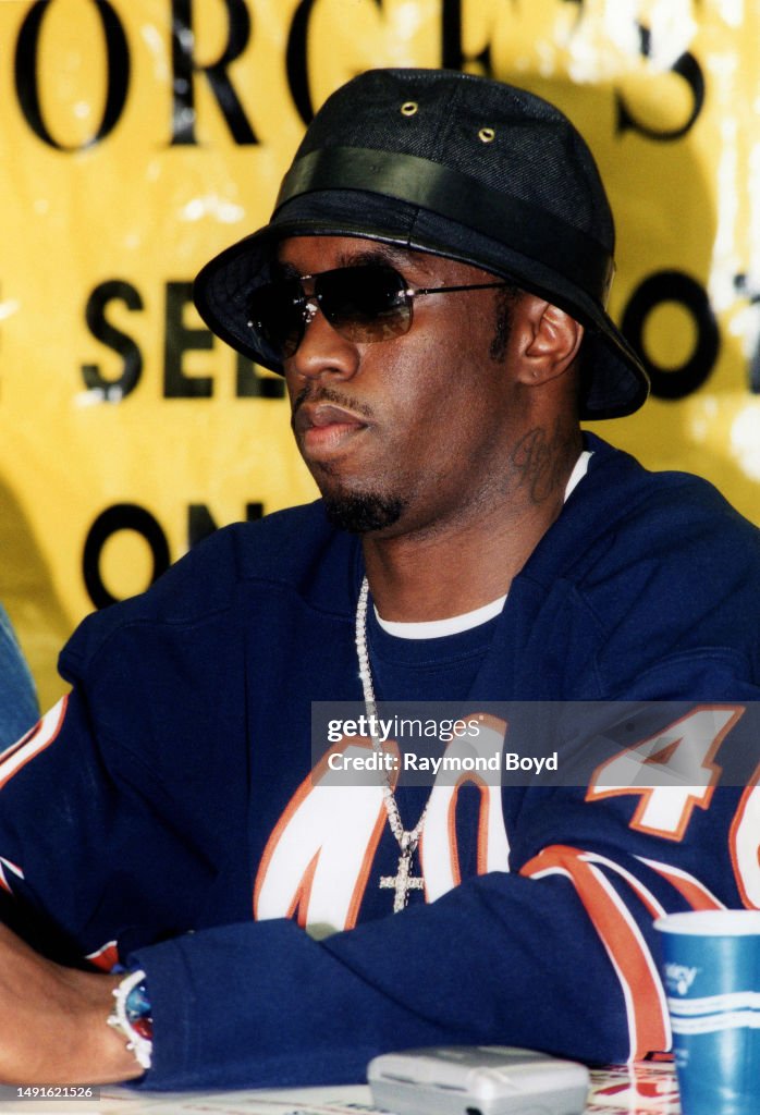 Puff Comb Rapper and producer Sean 'Puffy' Combs signs autographs and greets ...