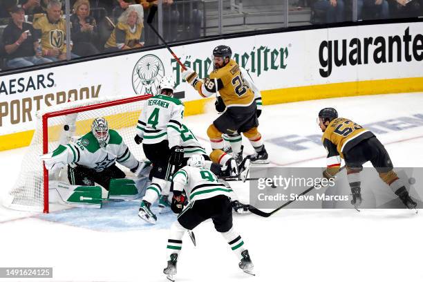 Teddy Blueger of the Vegas Golden Knights scores a goal past Jake Oettinger of the Dallas Stars during the third period in Game One of the Western...