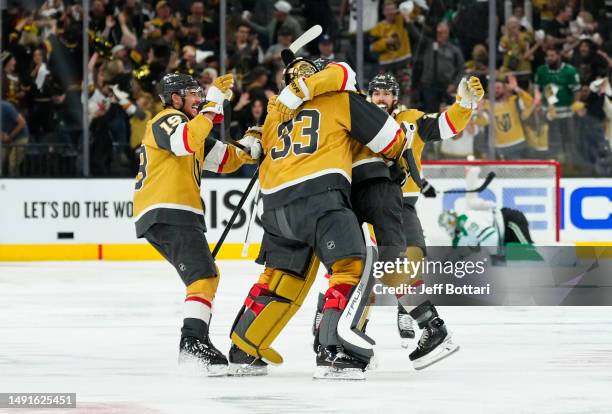 The Vegas Golden Knights celebrate after a 4-3 overtime victory against the Dallas Stars in Game One of the Western Conference Final of the 2023...