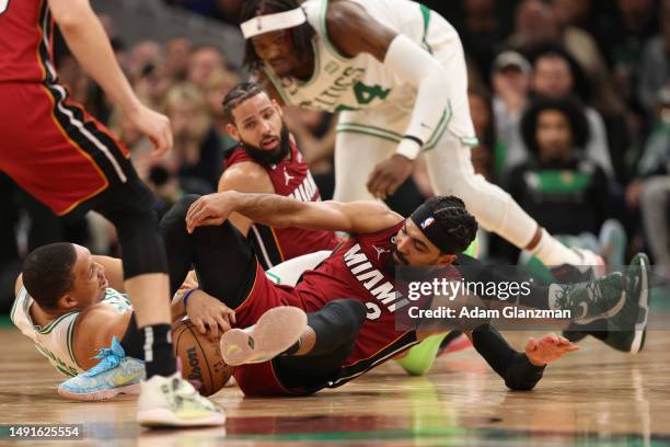 Grant Williams of the Boston Celtics battles for a loose ball against Gabe Vincent of the Miami Heat during the fourth quarter in game two of the...