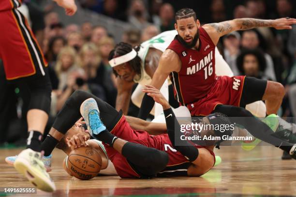 Grant Williams of the Boston Celtics battles for a loose ball against Gabe Vincent of the Miami Heat during the fourth quarter in game two of the...
