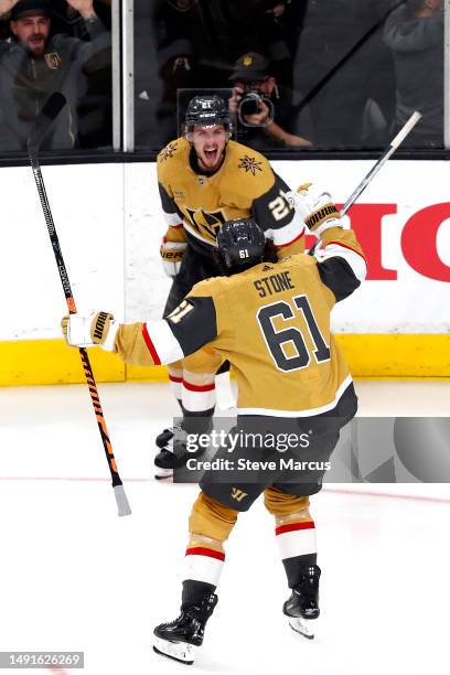 Brett Howden of the Vegas Golden Knights is congratulated by Mark Stone after scoring the game-winning goal against the Dallas Stars during overtime...