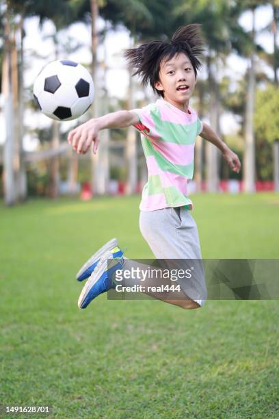 boy practicing soccer skill - soccer training grounds stock pictures, royalty-free photos & images