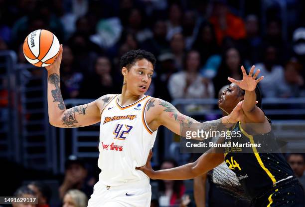 Brittney Griner of the Phoenix Mercury controls the ball against Joyner Holmes of the Los Angeles Sparks in the first half at Crypto.com Arena on May...