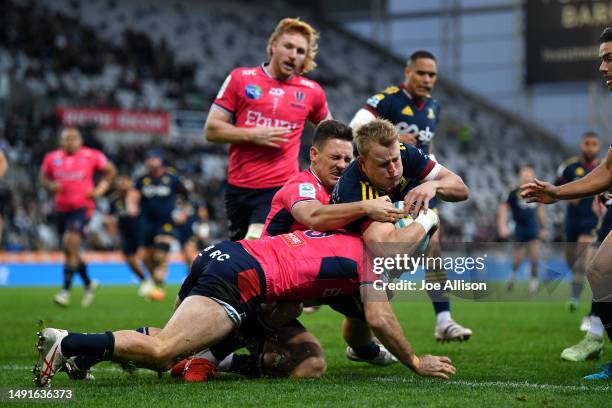 Sam Gilbert of the Highlanders dives across to score a try which was disallowed during the round 13 Super Rugby Pacific match between Highlanders and...