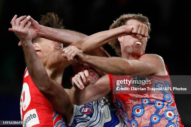 Dane Rampe and Nick Blakey of the Swans compete with Todd Goldstein of the Kangaroos during the round 10 AFL match between North Melbourne Kangaroos...