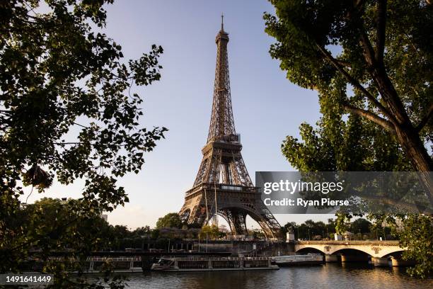 The Eiffel Tower is seen at sunrise on May 16, 2023 in Paris, France.