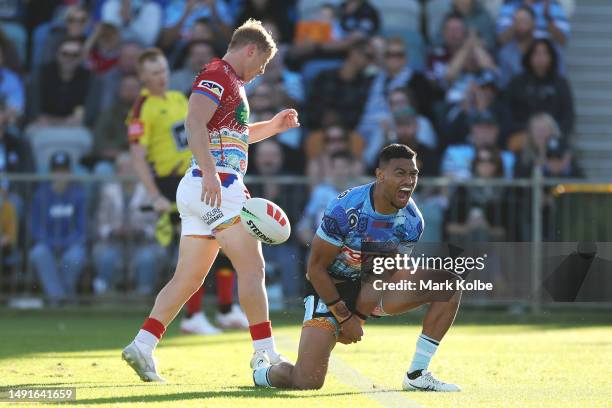 Ronaldo Mulitalo of the Sharks celebrates scoring a try during the round 12 NRL match between Cronulla Sharks and Newcastle Knights at Coffs Harbour...