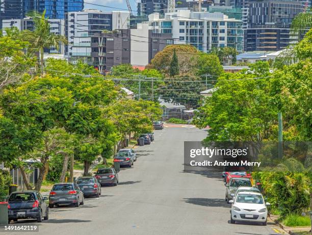 green trees, city apartments road cars - andrea park stock pictures, royalty-free photos & images