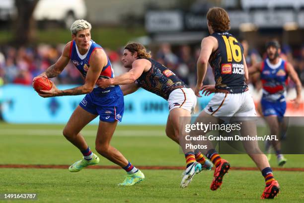 Rory Lobb of the Bulldogs is tackled during the round 10 AFL match between Western Bulldogs and Adelaide Crows at Mars Stadium on May 20, 2023 in...