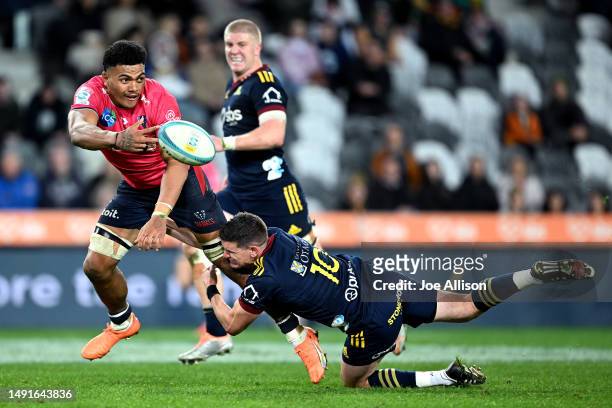 Vaiolini Ekuasi of the Rebels offloads the ball during the round 13 Super Rugby Pacific match between Highlanders and Melbourne Rebels at Forsyth...