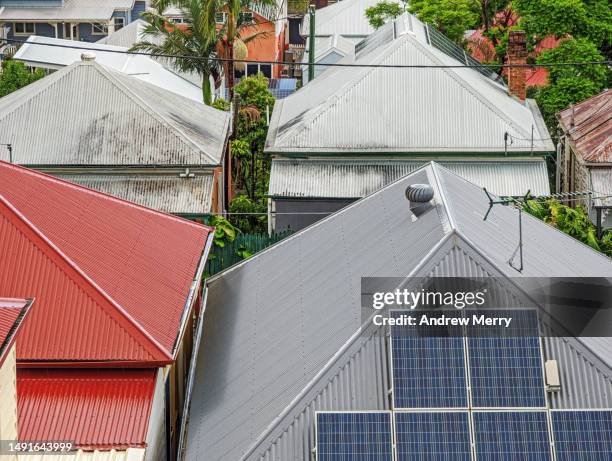 houses corrugated iron roofs solar closeup - galvanized stock pictures, royalty-free photos & images