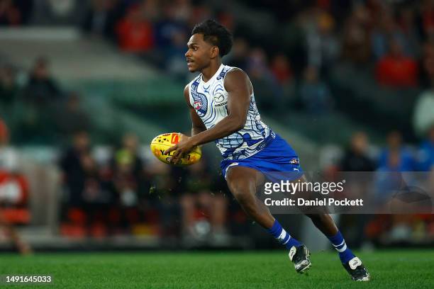 Phoenix Spicer of the Kangaroos looks to pass the ball during the round 10 AFL match between North Melbourne Kangaroos and Sydney Swans at Marvel...