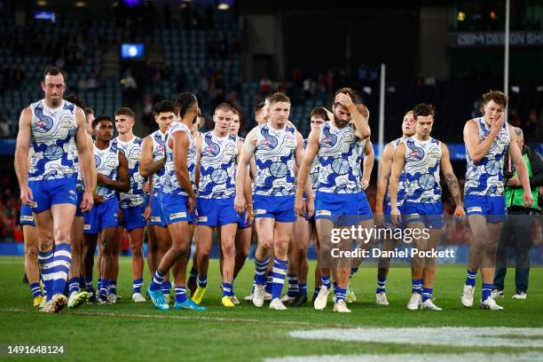 The Kangaroos looks dejected after the round 10 AFL match between North Melbourne Kangaroos and Sydney Swans at Marvel Stadium, on May 20 in...