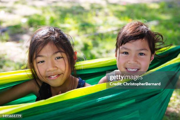 fun in hammock - asian family camping stock pictures, royalty-free photos & images