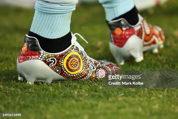 The painted boots of Jesse Ramien of the Sharks are seen during the round 12 NRL match between Cronulla Sharks and Newcastle Knights at Coffs Harbour...