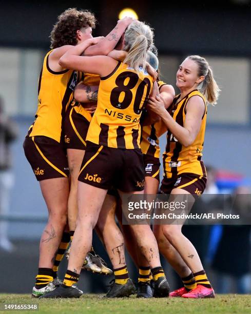 Box Hill Hawks team mates congratulate Gabby Collingwood of the Box Hill Hawks after kicking the winning goal during the round nine VFLW match...